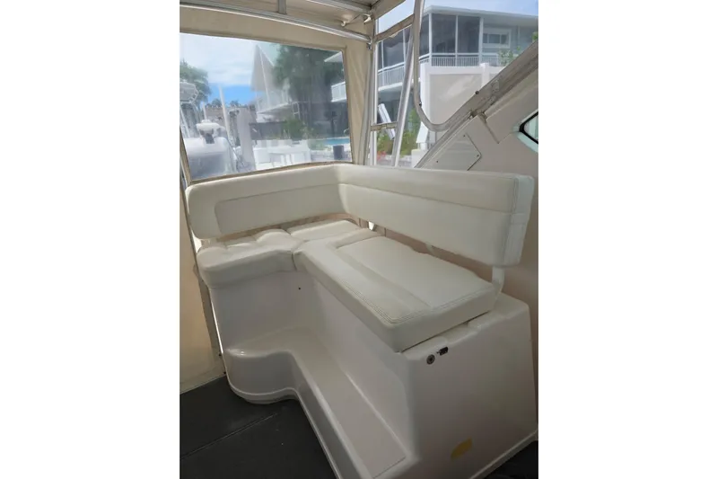  Yacht Photos Pics 2006 Tiara Yachts 3600 Open interior seating with white cushions and window view.