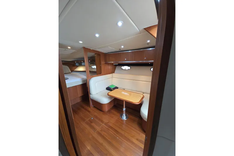  Yacht Photos Pics 2006 Tiara Yachts 3600 Open interior with cozy seating and wooden accents.