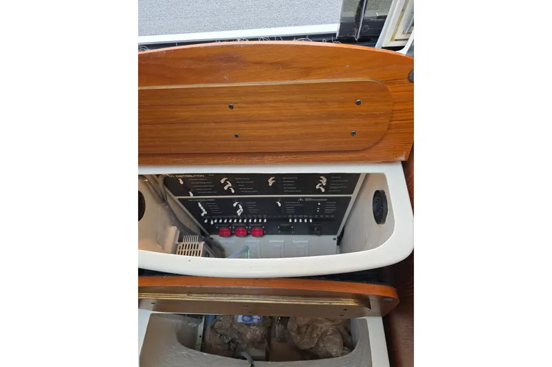  Yacht Photos Pics Electrical panel inside 2006 Tiara Yachts 3600 Open, featuring wooden cabinetry.