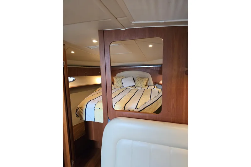  Yacht Photos Pics 2006 Tiara Yachts 3600 Open cabin interior with cozy bed and wooden accents.