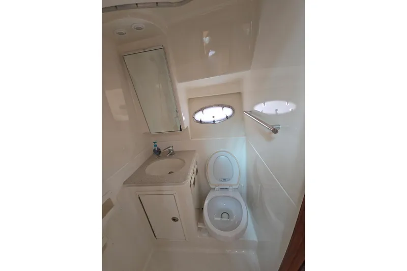  Yacht Photos Pics Bathroom interior of 2006 Tiara Yachts 3600 Open, featuring sink and toilet.