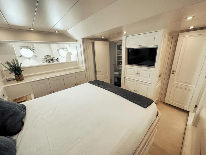 Laziza Yacht Photos Pics Luxurious bedroom interior of 2004 Benetti Sail Division 82 RPH yacht, featuring elegant decor and modern amenities.