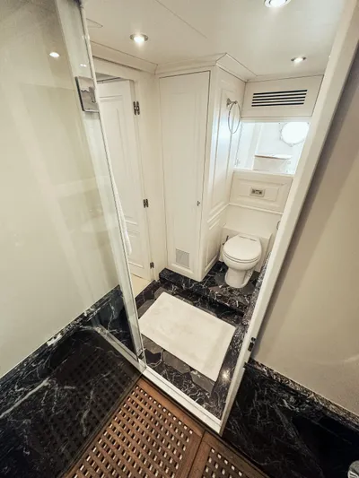 Laziza Yacht Photos Pics Luxurious bathroom on 2004 Benetti Sail Division 82 RPH yacht with marble flooring.