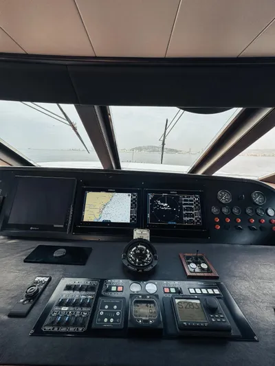 Laziza Yacht Photos Pics Control panel of 2004 Benetti Sail Division 82 RPH yacht with navigation screens.