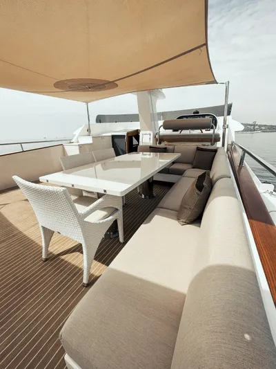 Laziza Yacht Photos Pics Luxurious 2004 Benetti Sail Division 82 RPH yacht deck with elegant seating and dining area.