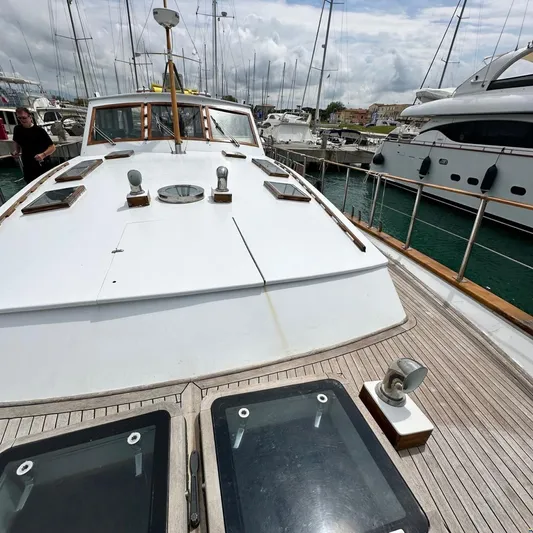  Yacht Photos Pics 1994 Viking Marin Caicco yacht docked in marina, showcasing deck and cabin details.