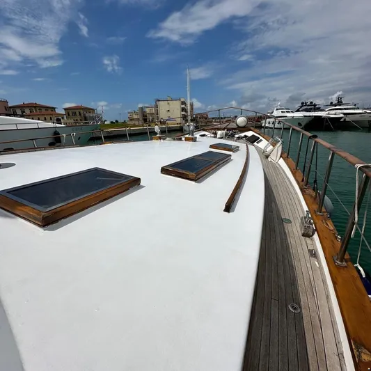  Yacht Photos Pics Deck view of 1994 Viking Marin Caicco yacht docked in a marina.