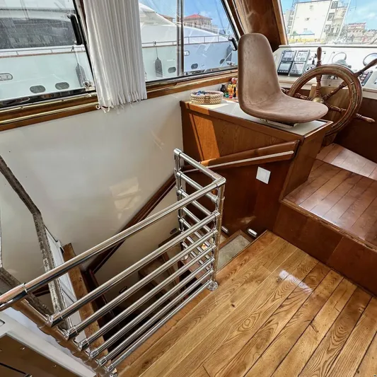  Yacht Photos Pics Interior of 1994 Viking Marin Caicco yacht with wooden stairs and steering wheel.