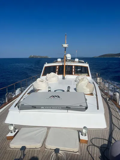  Yacht Photos Pics 1994 Viking Marin Caicco yacht cruising on open sea under clear blue sky.