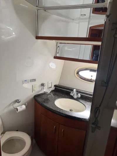  Yacht Photos Pics 2007 Carver 46 Voyager yacht bathroom with sink, toilet, and storage cabinets.