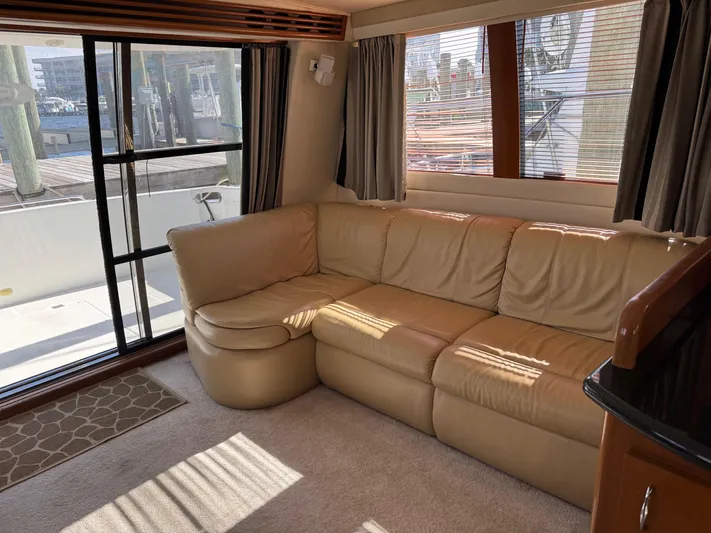  Yacht Photos Pics Interior of 2007 Carver 46 Voyager yacht with beige leather sofa and large windows.