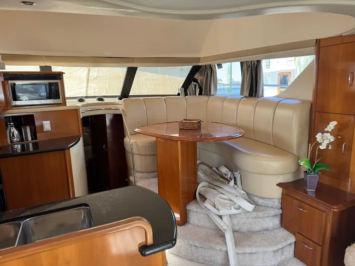  Yacht Photos Pics Interior of 2007 Carver 46 Voyager yacht with dining area and kitchenette.