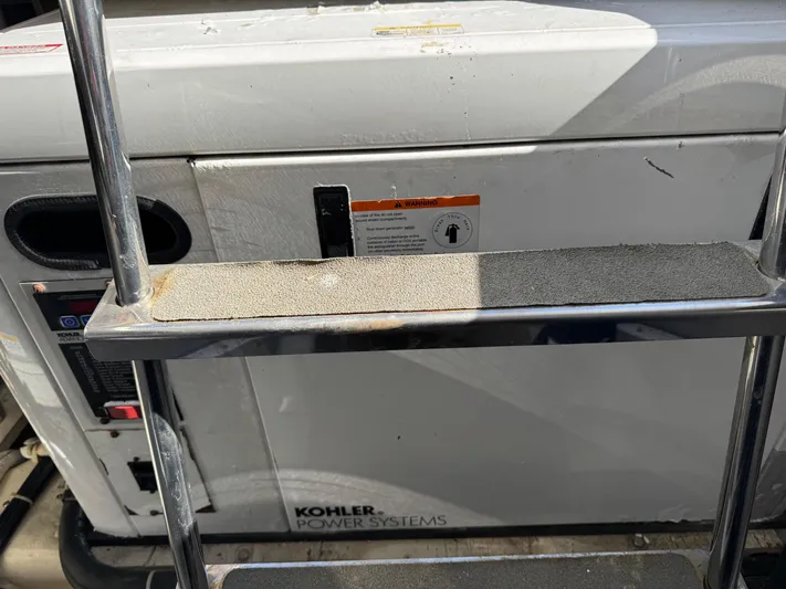  Yacht Photos Pics Kohler power system on 2007 Carver 46 Voyager yacht, viewed through ladder.