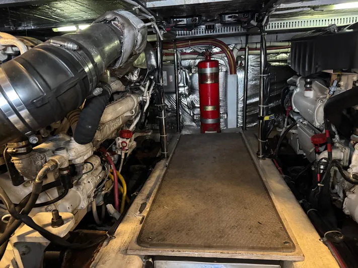 Yacht Photos Pics Engine room of 2007 Carver 46 Voyager yacht, featuring dual engines and fire extinguisher.