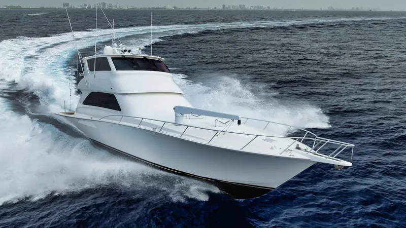 Nailed It Yacht Photos Pics Viking 74EB yacht cruising on open sea, 2008 model, creating waves.