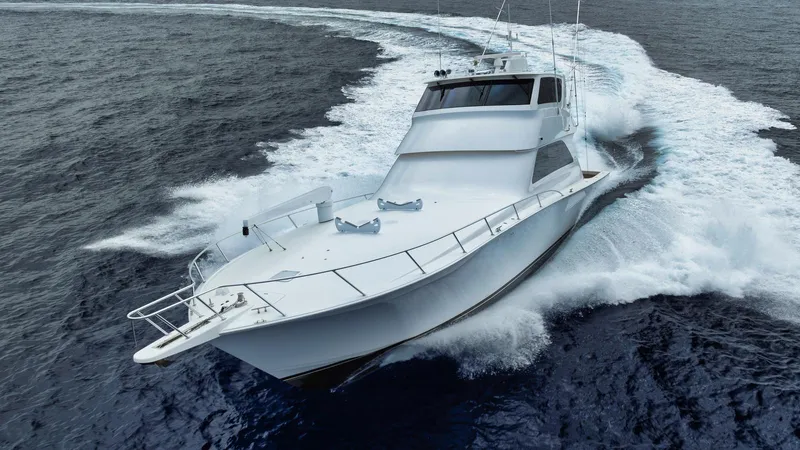 Nailed It Yacht Photos Pics 2008 Viking 74EB yacht cruising swiftly on open ocean waters.