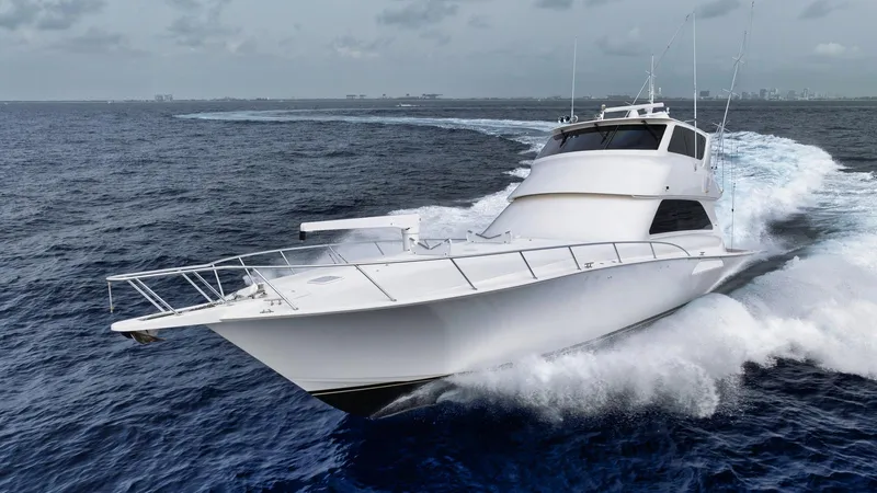 Nailed It Yacht Photos Pics 2008 Viking 74EB yacht cruising on open ocean under cloudy skies.