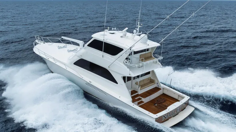 Nailed It Yacht Photos Pics 2008 Viking 74EB yacht cruising on open sea, showcasing sleek design and powerful performance.