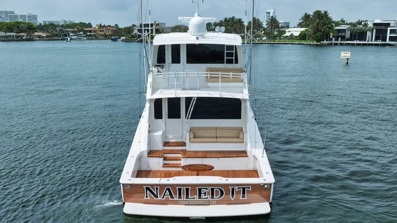 Nailed It Yacht Photos Pics 2008 Viking 74EB yacht "Nailed It" on water, rear view, luxury boat.