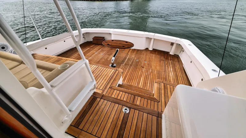 Nailed It Yacht Photos Pics Luxurious 2008 Viking 74EB yacht deck with teak flooring and ocean view.