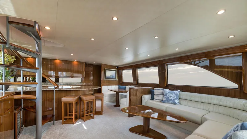 Nailed It Yacht Photos Pics Luxurious interior of 2008 Viking 74EB yacht with elegant seating and modern design.