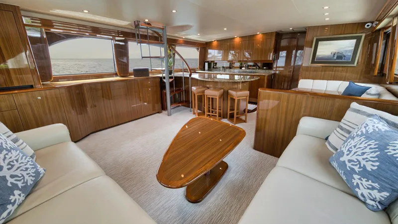 Nailed It Yacht Photos Pics Luxurious interior of 2008 Viking 74EB yacht with elegant wood finishes and ocean view.