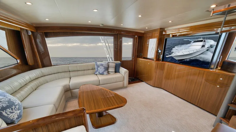 Nailed It Yacht Photos Pics Luxurious interior of 2008 Viking 74EB yacht with elegant wood finishes and ocean view.