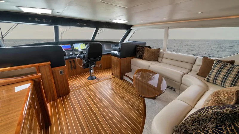 Nailed It Yacht Photos Pics Luxurious 2008 Viking 74EB yacht interior with plush seating and elegant wood finishes.