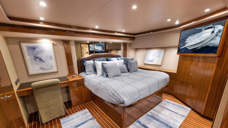 Nailed It Yacht Photos Pics Luxurious bedroom interior of 2008 Viking 74EB yacht with elegant wood finishes.