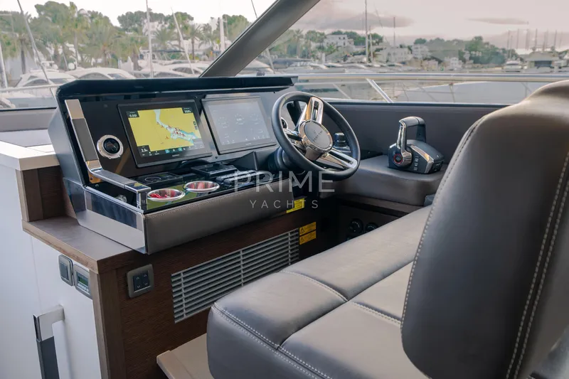 One Step Closer Yacht Photos Pics Luxurious 2024 Prestige 590 yacht helm with advanced navigation systems and plush seating.