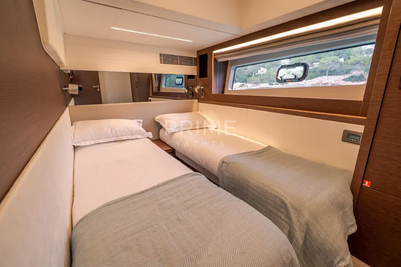 One Step Closer Yacht Photos Pics Luxurious twin cabin interior of 2024 Prestige 590 yacht with modern design elements.