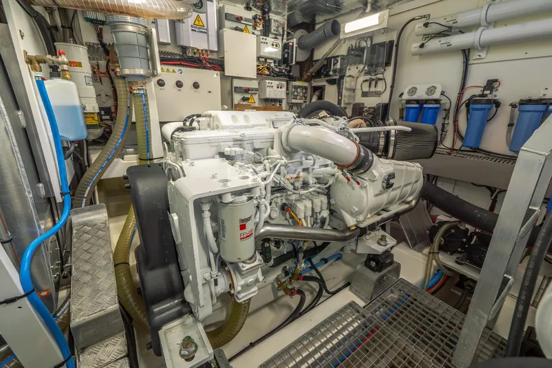 One Step Closer Yacht Photos Pics Engine room of 2024 Prestige 590 yacht, showcasing advanced machinery and systems.