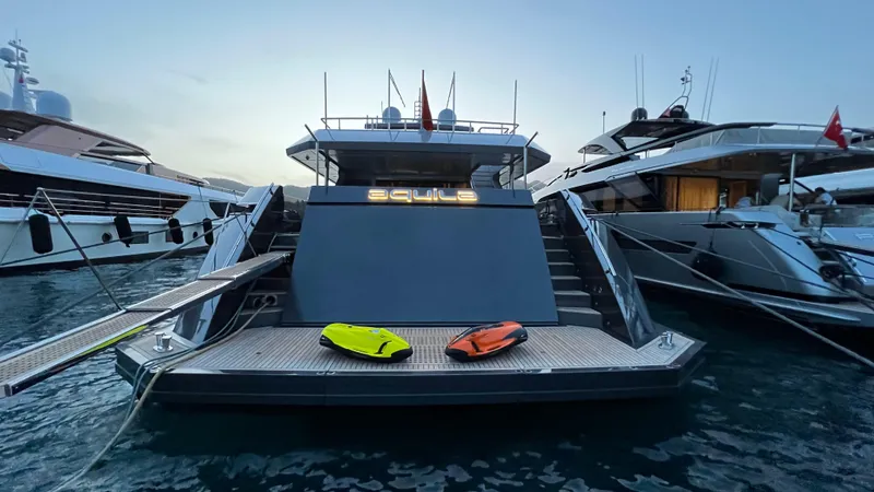 Aquila Yacht Photos Pics Luxury yacht Mengi Yay 36M Pennon 2015 docked with watercraft on deck.