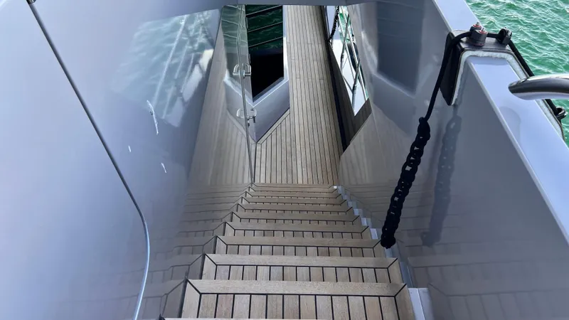 Aquila Yacht Photos Pics Staircase on 2015 Mengi Yay 36M Pennon yacht, featuring sleek design and wooden steps.