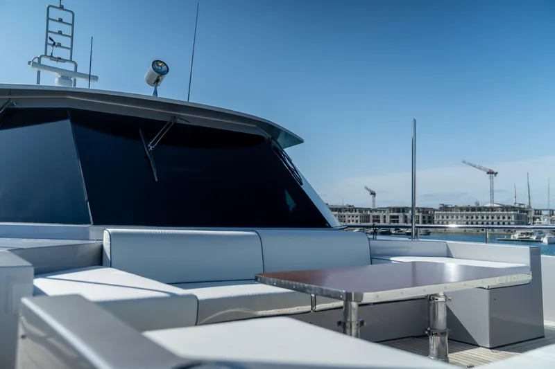 Aquila Yacht Photos Pics Luxurious 2015 Mengi Yay 36M Pennon yacht with sleek seating and table on deck.