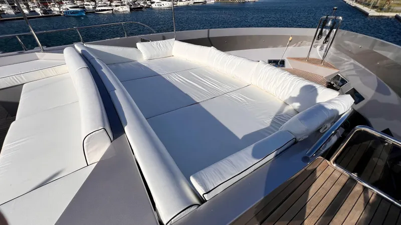 Aquila Yacht Photos Pics Luxurious sunbathing area on 2015 Mengi Yay 36M Pennon yacht, docked at marina.