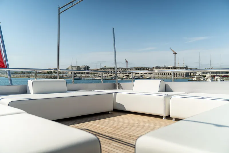 Aquila Yacht Photos Pics Luxurious deck seating on 2015 Mengi Yay 36M Pennon yacht, with marina view.