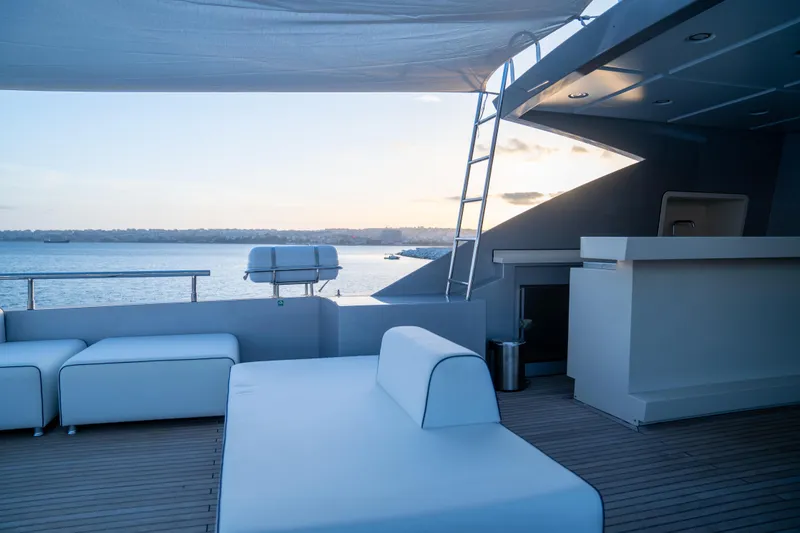 Aquila Yacht Photos Pics Luxurious deck of 2015 Mengi Yay 36M Pennon yacht with modern seating and ocean view.