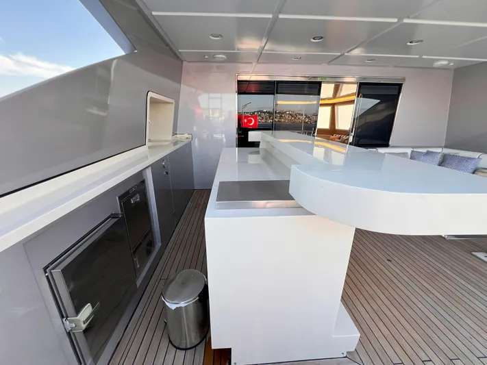 Aquila Yacht Photos Pics Luxury yacht Mengi Yay 36M Pennon 2015, featuring sleek outdoor bar and seating area.