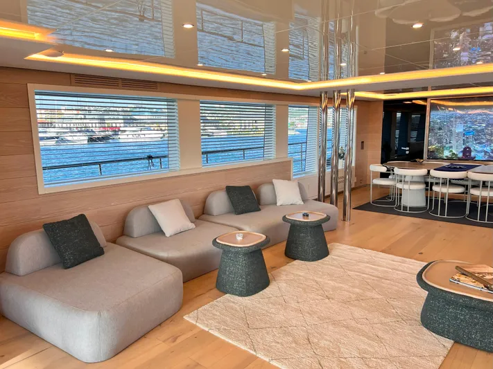 Aquila Yacht Photos Pics Luxurious interior of 2015 Mengi Yay 36M Pennon yacht with modern seating and dining area.