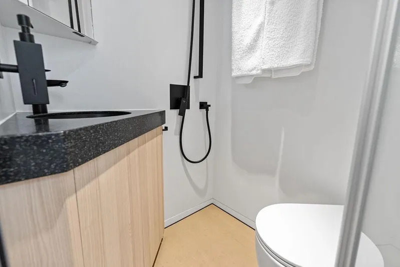 Fellowship II Yacht Photos Pics Modern bathroom interior in 2023 Wajer 77 yacht, featuring sleek fixtures and minimalist design.