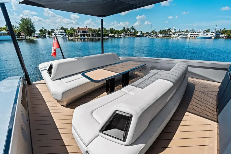 Fellowship II Yacht Photos Pics Luxurious 2023 Wajer 77 yacht deck with elegant seating and scenic waterfront view.