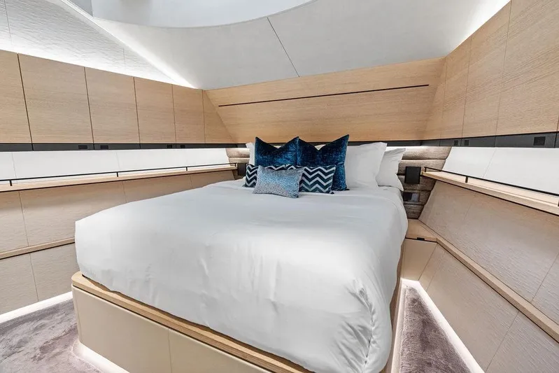 Fellowship II Yacht Photos Pics Luxurious bedroom interior of 2023 Wajer 77 yacht with modern design and plush bedding.