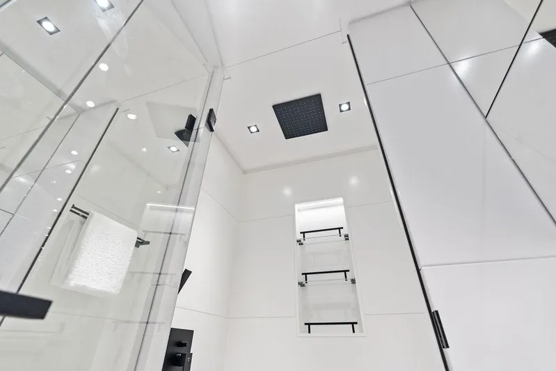 Fellowship II Yacht Photos Pics Luxurious bathroom interior on 2023 Wajer 77 yacht, featuring sleek modern design and glass elements.