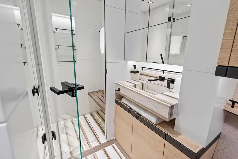Fellowship II Yacht Photos Pics Luxurious bathroom interior of 2023 Wajer 77 yacht with modern fixtures and elegant design.