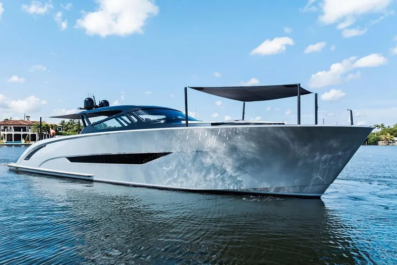 Fellowship II Yacht Photos Pics Luxury 2023 Wajer 77 yacht on calm water under a clear blue sky.