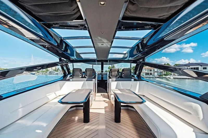 Fellowship II Yacht Photos Pics Luxurious interior of 2023 Wajer 77 yacht with panoramic windows and elegant seating.