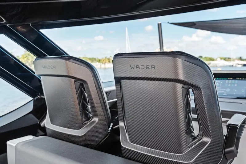 Fellowship II Yacht Photos Pics Luxury interior of 2023 Wajer 77 yacht with sleek, modern design and carbon fiber seats.