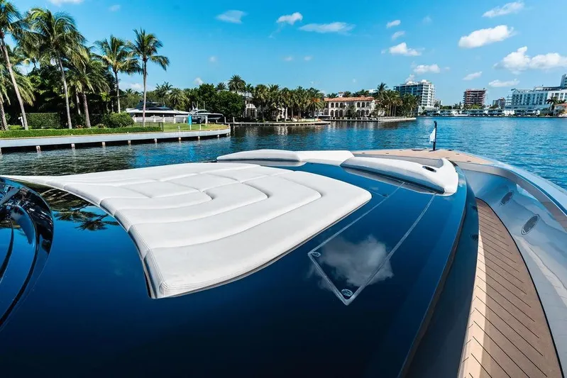 Fellowship II Yacht Photos Pics Luxurious 2023 Wajer 77 yacht with sleek design, docked by palm-lined waterfront.