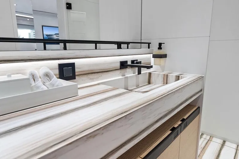 Fellowship II Yacht Photos Pics Luxurious bathroom sink in 2023 Wajer 77 yacht, featuring modern design and elegant fixtures.